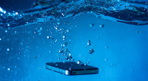 mobile-phone-under-blue-water